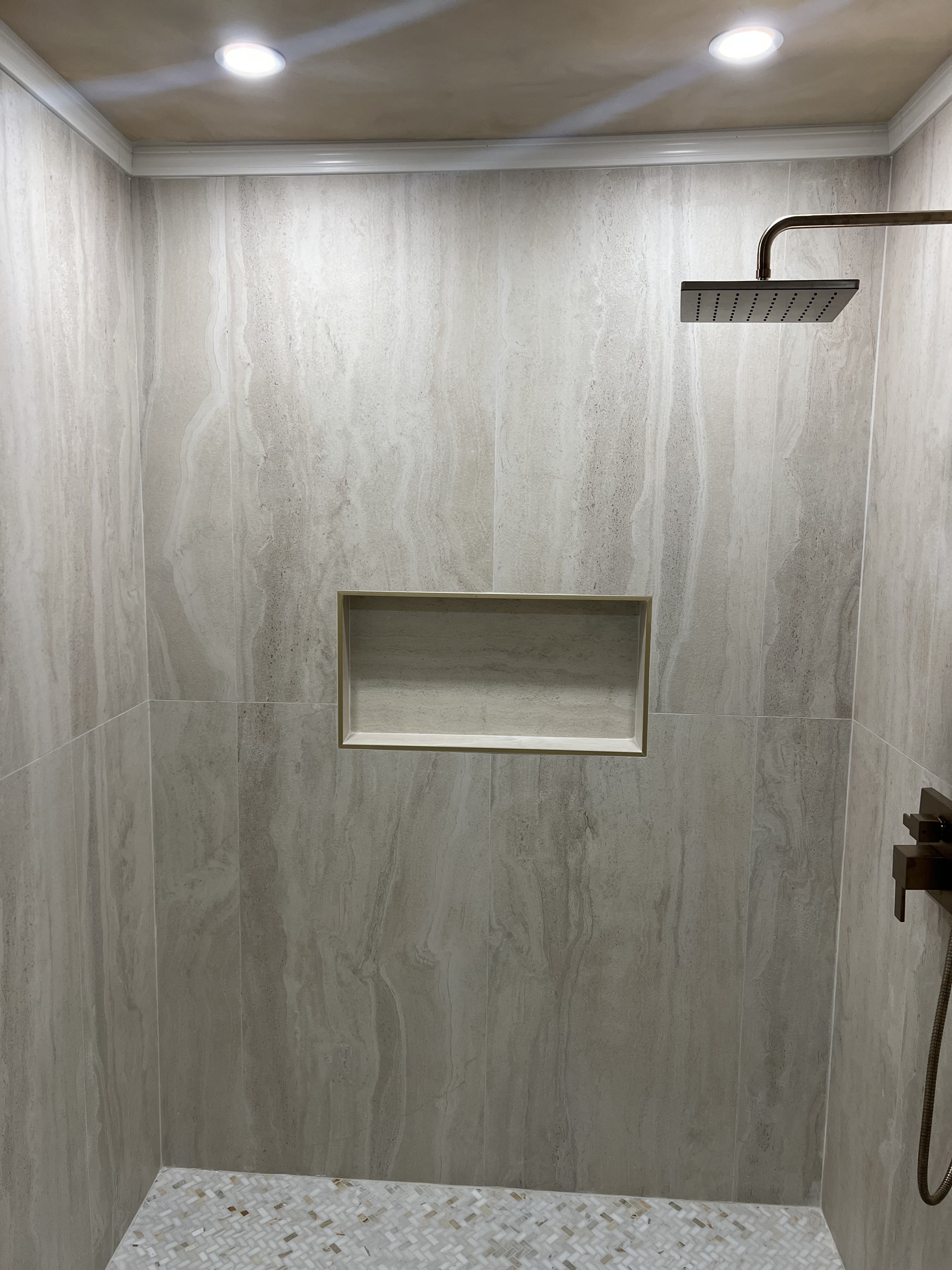 Walk-in shower with stone tile walls